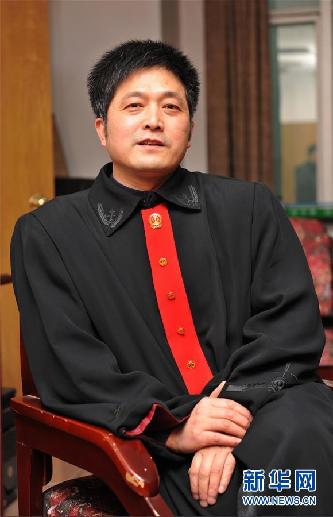 (圖文互動)其人如蘭,既潔且馨——追記“全國模范法官”胡國運