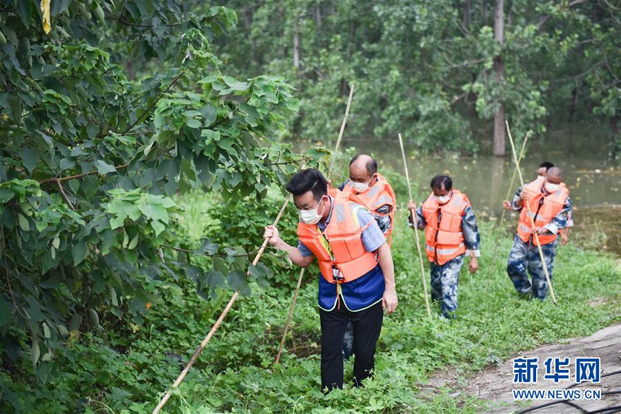 (在習近平新時代中國特色社會主義思想指引下——新時代新作為新篇章·習近平總書記關切事·圖文互動)(2)戰疫魔,斗洪魔——湖北全力應對防疫、防汛疊加“雙考”